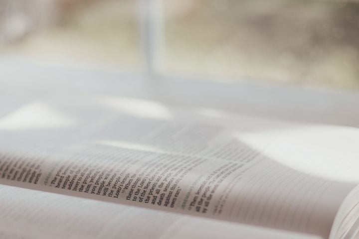 Open Bible with window in background