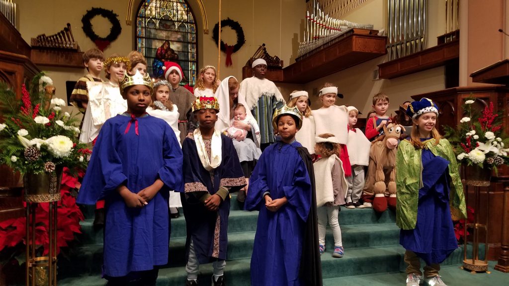 Christmas Eve Pageant for families with kids as kings, Mary, Joseph, donkey, shepherds, and angels.