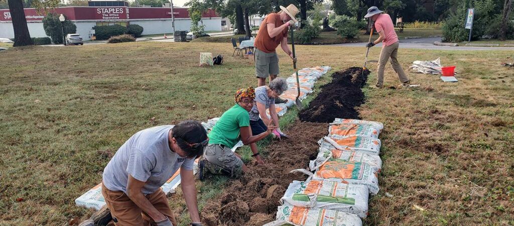 Govans Community Farm workers digging